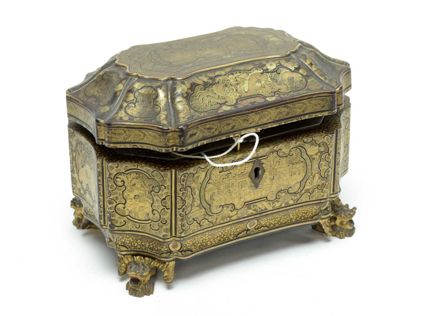 Lot 265 - A Chinese lacquered and gilt decorated sarcophagus tea caddy