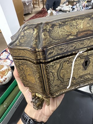 Lot 265 - A Chinese lacquered and gilt decorated sarcophagus tea caddy