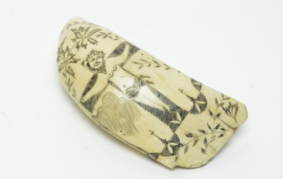 Lot 709 - An antique scrimshaw whale's tooth
