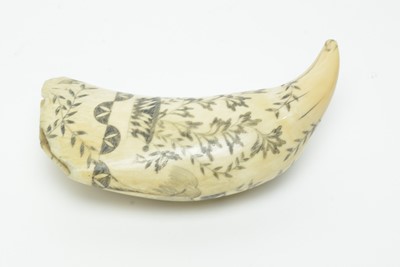 Lot 709 - An antique scrimshaw whale's tooth