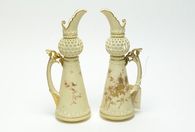 Lot 350 - A pair of Royal Worcester ewers