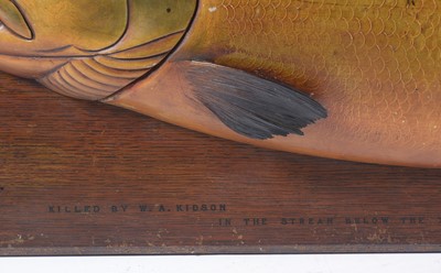 Lot 1324 - A large carved and painted half-block trophy model of a salmon