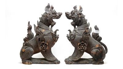 Lot 875 - A pair of carved wood temple lions or Fu dogs