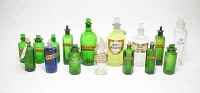 Lot 233 - A collection of 19th Century and later glass apothecary bottles