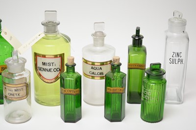Lot 233 - A collection of 19th Century and later glass apothecary bottles