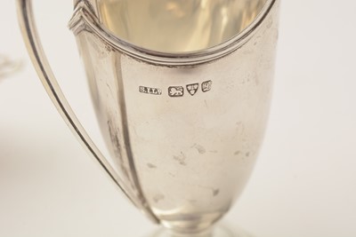 Lot 112 - Silver tea caddy, strainer and milk jug