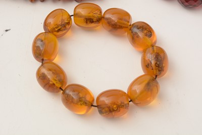 Lot 177 - A selection of amber, reconstituted amber and simulated-amber jewellery