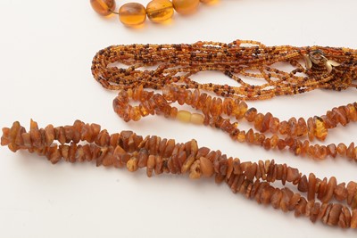 Lot 177 - A selection of amber, reconstituted amber and simulated-amber jewellery