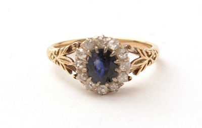 Lot 165 - A sapphire and diamond cluster ring