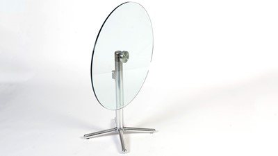 Lot 40 - A contemporary chrome and glass tilt action table