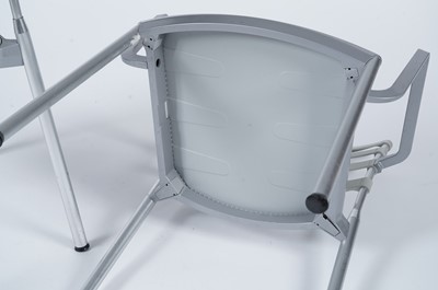 Lot 27 - A contemporary chrome and glass tilt action table / Fritz Hansen - Ice dining chair by Kaspar Salto
