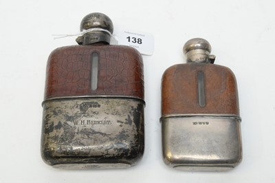 Lot 138 - Two leather and silver mounted hip flasks