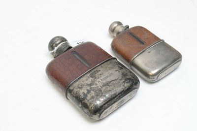 Lot 138 - Two leather and silver mounted hip flasks
