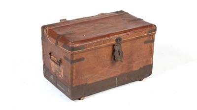 Lot 1328 - A vintage leather and metal bound travelling trunk.