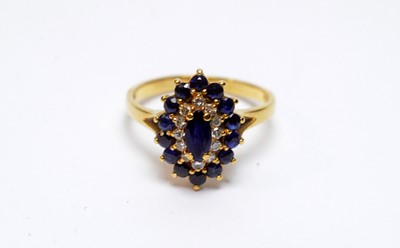 Lot 98 - A sapphire and diamond cluster ring