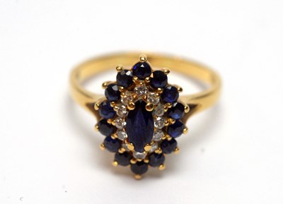 Lot 98 - A sapphire and diamond cluster ring
