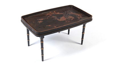 Lot 1300 - A decorative Japanese black lacquered tray on stand, early 20th Century