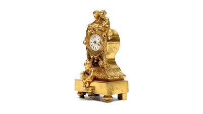 Lot 1270 - A decorative cast gilt brass boudoir clock