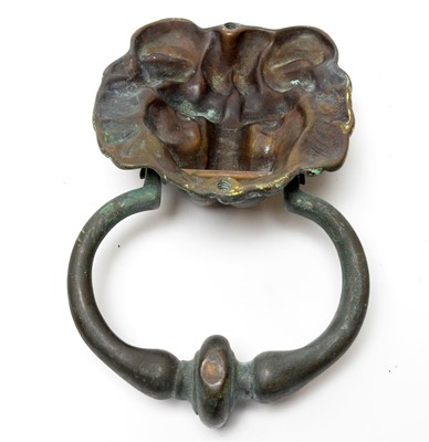 Lot 723 - A patinated brass lion mask door knocker