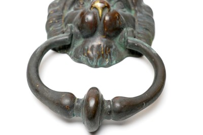 Lot 723 - A patinated brass lion mask door knocker