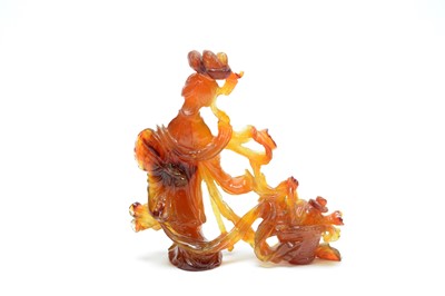 Lot 851 - A Chinese carved agate figure of Quanyin