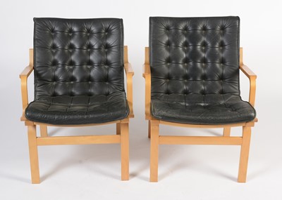 Lot 15 - Nielaus Mobler of Denmark: a pair of mid-Century teak and black leather button back lounge chairs