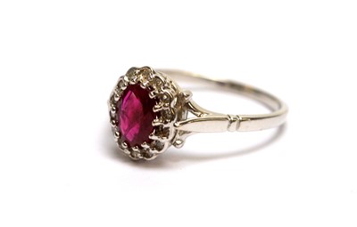 Lot 82 - A diamond rings and a ruby and diamond cluster ring