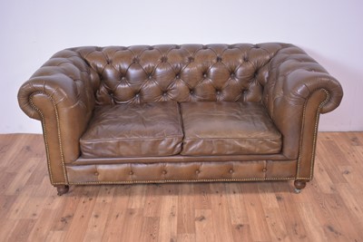 Lot 42 - A modern brown leather Chesterfield sofa