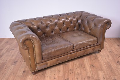 Lot 42 - A modern brown leather Chesterfield sofa