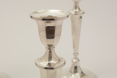 Lot 18 - A set of four Elizabeth II silver candlesticks