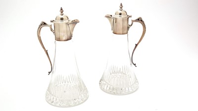 Lot 20 - A pair of Elizabeth II silver-mounted cut-glass claret jugs