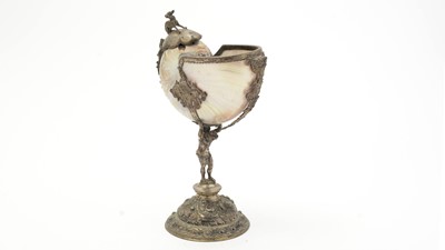 Lot 1401 - A 19th Century Continental silver and parcel-gilt mounted nautilus shell cup