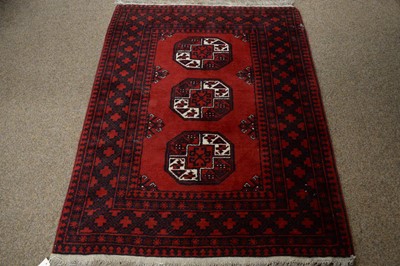 Lot 59 - A vintage 20th Century Afghan Aqsha rug with another