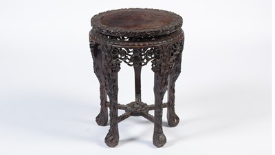 Lot 849 - A substantial Chinese carved hardwood jardiniere/bowl stand, late 19th/early 20th Century