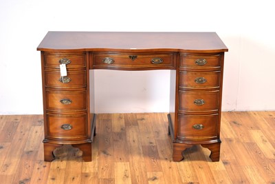 Lot 1 - Bevan Funnell: A Georgian-style mahogany serpentine writing desk retailed by Chapmans, Newcastle