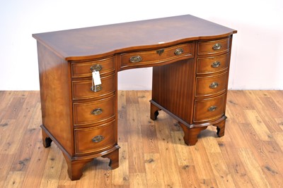 Lot 1 - Bevan Funnell: A Georgian-style mahogany serpentine writing desk retailed by Chapmans, Newcastle