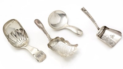 Lot 495 - A George III silver caddy spoon; and three others