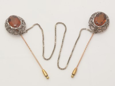 Lot 498 - A pair of Victorian citrine cloak pins