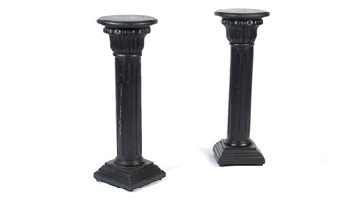 Lot 1305 - A pair of decorative ebonised classical column style pedestals