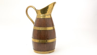 Lot 729 - An early 19th Century coopered oak and brass jug