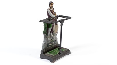 Lot 1473 - A cast iron William Wallace stick stand, late 19th/20th century