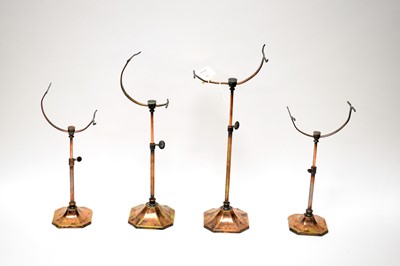 Lot 209 - A collection of early 20th Century adjustable copper plated brass shoe stands