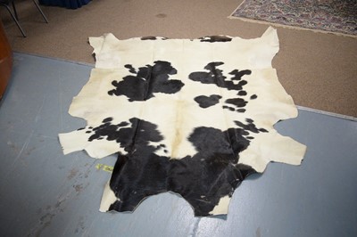 Lot 70A - A cow hide rug