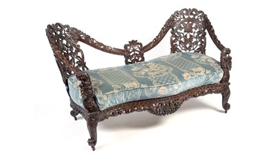 Lot 1492 - A decorative late 19th Century Anglo-Indian carved hardwood two seater sofa
