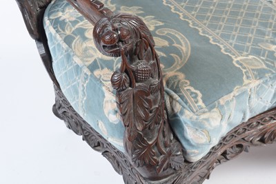 Lot 968 - A decorative late 19th Century Anglo-Indian carved hardwood two seater sofa