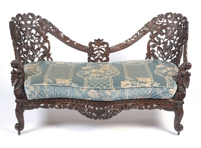 Lot 968 - A decorative late 19th Century Anglo-Indian carved hardwood two seater sofa