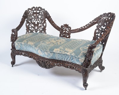 Lot 968 - A decorative late 19th Century Anglo-Indian carved hardwood two seater sofa