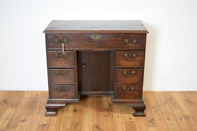 Lot 22 - A mid 18th Century mahogany kneehole desk with secretaire drawer