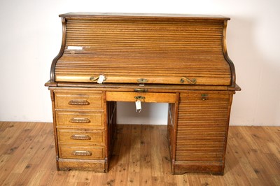 Lot 67 - An early 20th Century oak roll top desk by Stolzenberg
