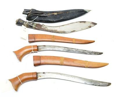 Lot 983 - Two Malayan daggers, and a Kukri